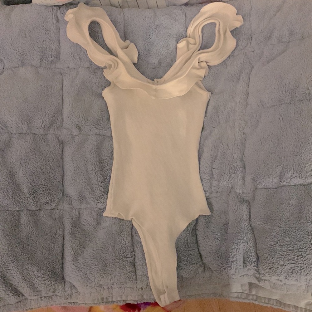 Size Small Onesie with ruffles along the collar